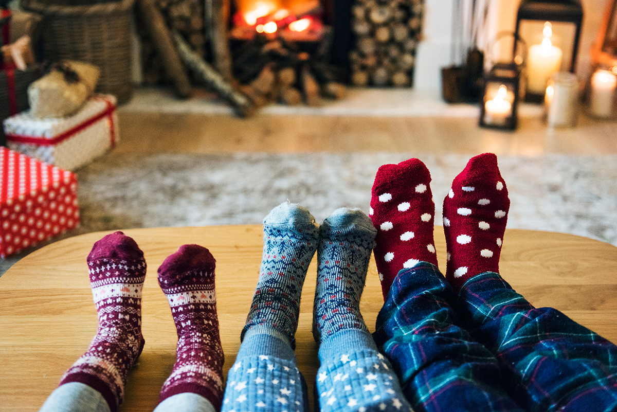 Family in front of fire